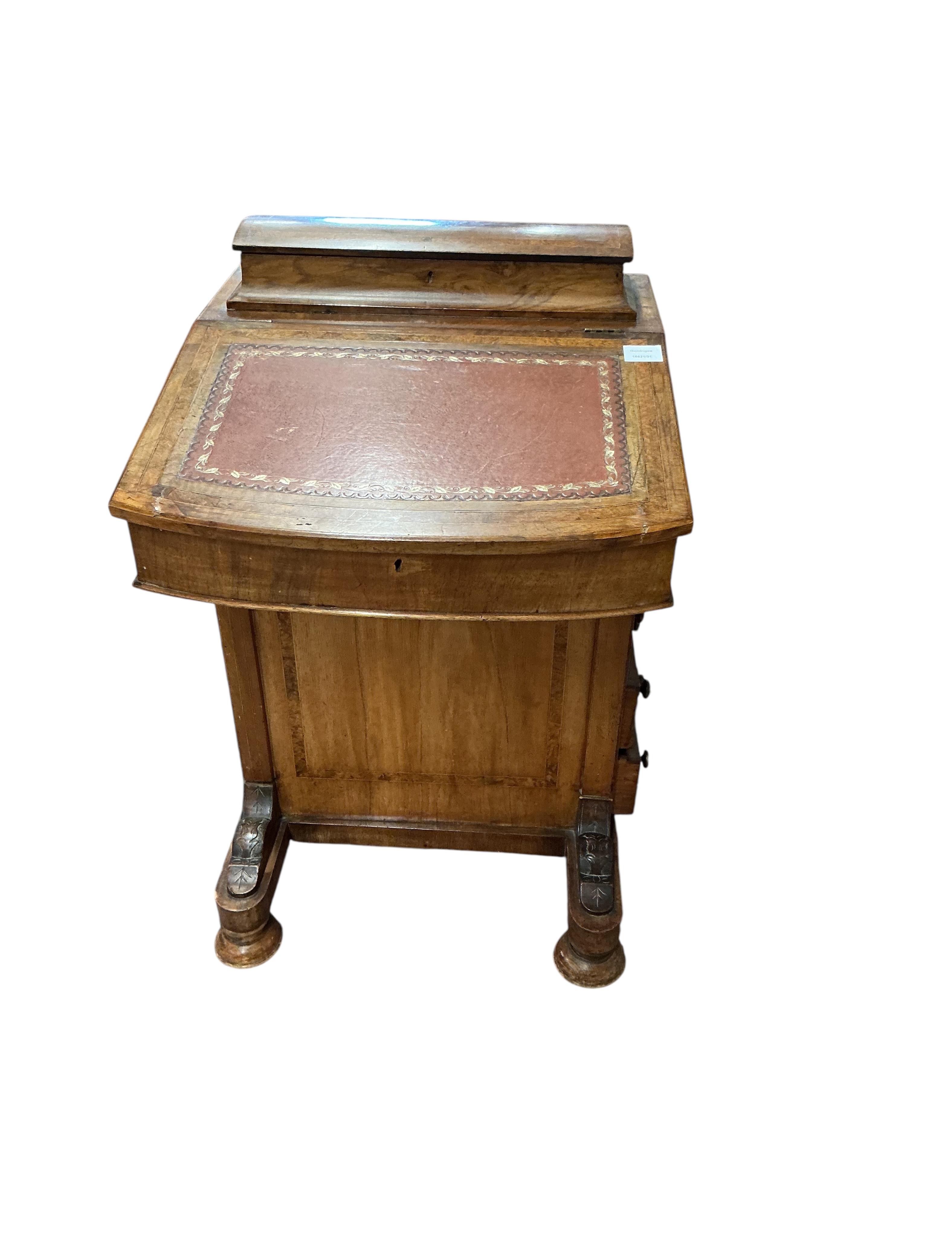 A late Victorian banded walnut Davenport, width 53cm, depth 54cm, height 84cm